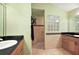 Well-maintained bathroom with a separate shower and dual sink vanity at 1339 Florence Path, The Villages, FL 32162