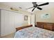 Bedroom featuring closet with double doors, bed, and ceiling fan at 1339 Florence Path, The Villages, FL 32162