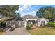 Charming home with a well-manicured lawn, three car garage, and attractive landscaping at 1339 Florence Path, The Villages, FL 32162