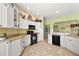 Bright and airy kitchen with granite counters and stainless-steel appliances at 1339 Florence Path, The Villages, FL 32162