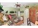 Relaxing bedroom with a ceiling fan, carpeted floors, and wicker furniture at 1339 Florence Path, The Villages, FL 32162