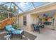 Patio with umbrella covered seating and view of a large green yard at 1339 Florence Path, The Villages, FL 32162