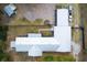 Aerial view of the property layout including outbuildings and ample parking at 14100 Ne 46Th St, Silver Springs, FL 34488