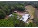 Aerial view of the home and wooded, fenced property at 14100 Ne 46Th St, Silver Springs, FL 34488