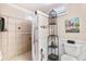 Cozy, neutral bathroom featuring shelving, and decor at 14100 Ne 46Th St, Silver Springs, FL 34488