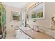 Well-lit bathroom featuring a vanity with a sink and ample counter space at 14100 Ne 46Th St, Silver Springs, FL 34488