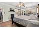 Bedroom featuring natural lighting, barn door, and mirrored closet at 14100 Ne 46Th St, Silver Springs, FL 34488