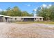 Exterior shot of home featuring a fenced horse property at 14100 Ne 46Th St, Silver Springs, FL 34488