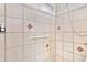 Neutral shower with grab bar, tile walls and tile flooring at 14100 Ne 46Th St, Silver Springs, FL 34488