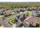 Aerial view of a neighborhood showcasing homes with well-maintained lawns and landscaping at 14842 Cedar Branch Way, Orlando, FL 32824