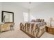 Bright bedroom with a desk, window, and patterned bedding at 14842 Cedar Branch Way, Orlando, FL 32824