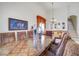 Formal dining area with a large window, and elegant decor at 14842 Cedar Branch Way, Orlando, FL 32824