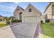 Charming home featuring a two-car garage, well-maintained landscaping, and a welcoming front entrance at 14842 Cedar Branch Way, Orlando, FL 32824