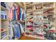 Organized walk-in closet providing ample storage space for clothing, shoes, and accessories at 14842 Cedar Branch Way, Orlando, FL 32824