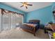 Bedroom with a bed, natural light, and access to the pool area at 16705 Rolling Green Dr, Clermont, FL 34714