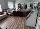 A clubhouse boasts a dark hardwood floor, sitting area and large bookcase at 16705 Rolling Green Dr, Clermont, FL 34714