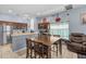 Eat-in kitchen with stainless steel appliances, tile floor, breakfast table, and coffee-themed decor at 16705 Rolling Green Dr, Clermont, FL 34714