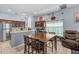 Functional kitchen featuring wooden cabinetry, a stainless steel refrigerator, and an eat-in dining space at 16705 Rolling Green Dr, Clermont, FL 34714