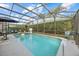 Refreshing pool and spa with screened enclosure, offering an outdoor oasis at 16705 Rolling Green Dr, Clermont, FL 34714