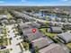 Beautiful aerial view of a neighborhood lined with palm trees, showcasing the property's location at 16726 Hidden Spring Dr, Clermont, FL 34714