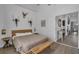 Cozy bedroom featuring natural wood accents and decorative wall art, leading to a bright kitchen at 16739 Hidden Spring Dr, Clermont, FL 34714