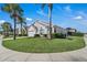 Well-maintained home featuring lush landscaping and a manicured lawn at 16739 Hidden Spring Dr, Clermont, FL 34714