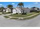 Exterior showcasing a well-maintained lawn and landscaping on a sunny day at 16739 Hidden Spring Dr, Clermont, FL 34714