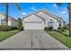 Charming single-story home with a well-manicured front yard, driveway, and attached garage at 16739 Hidden Spring Dr, Clermont, FL 34714