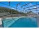 Sparkling in-ground pool with clear blue water and lounge seating at 16739 Hidden Spring Dr, Clermont, FL 34714