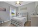 Calming bedroom featuring a cozy bed, soft decor, and a serene window view, creating a relaxing retreat at 1679 E County Road 462, Wildwood, FL 34785