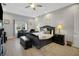 Spacious main bedroom featuring a tray ceiling and stylish decor at 1679 E County Road 462, Wildwood, FL 34785