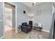 Relaxing sitting room with comfortable seating and a view into the elegant bathroom at 1679 E County Road 462, Wildwood, FL 34785