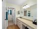 Bathroom featuring tile floors and countertops with adjoining toilet and shower at 17813 Se 95Th Ct, Summerfield, FL 34491