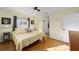 Bedroom featuring wood-look floors and a ceiling fan at 17813 Se 95Th Ct, Summerfield, FL 34491