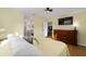 Bedroom featuring wood-look floors and attached bathroom at 17813 Se 95Th Ct, Summerfield, FL 34491