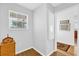 Bright hallway with warm wood flooring and plenty of natural light at 17979 Se 89Th Rothway Ct, The Villages, FL 32162