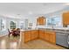 Kitchen area with oak cabinets, granite countertops, and stainless steel appliances at 17979 Se 89Th Rothway Ct, The Villages, FL 32162