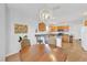 Kitchen and dining area with oak cabinets, granite countertops, and stainless steel appliances at 17979 Se 89Th Rothway Ct, The Villages, FL 32162