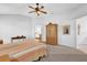 Spacious main bedroom with a ceiling fan and dresser at 17979 Se 89Th Rothway Ct, The Villages, FL 32162