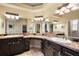 Luxurious bathroom featuring granite countertops, double sinks, and great lighting at 2059 Landings Ln, The Villages, FL 32162