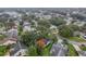 Overhead shot of residential neighborhood, with lake, showcasing the property's setting at 210 Palermo Pl, Lady Lake, FL 32159