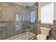 Modern bathroom boasts a glass-enclosed shower with marble tile and fixtures at 210 Palermo Pl, Lady Lake, FL 32159