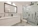 Modern bathroom with marble-style tiling, a glass-enclosed shower, and sleek fixtures at 210 Palermo Pl, Lady Lake, FL 32159