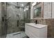 Modern bathroom with glass shower, sleek vanity, and updated fixtures at 210 Palermo Pl, Lady Lake, FL 32159