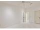 A bright room with neutral walls and marble floors, and two doors at 210 Palermo Pl, Lady Lake, FL 32159