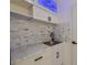 Charming laundry room equipped with marble countertops and storage cabinets at 210 Palermo Pl, Lady Lake, FL 32159