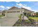 Charming home with manicured landscaping and a welcoming entryway at 2184 Locklin Ln, The Villages, FL 32163