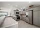 Modern kitchen featuring stainless steel appliances, gray cabinets, and granite countertops at 2184 Locklin Ln, The Villages, FL 32163