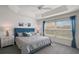 Relaxing main bedroom with large window and trey ceiling at 2184 Locklin Ln, The Villages, FL 32163