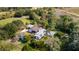 Expansive property featuring a home, outbuildings, RV, and a picturesque mix of open land and mature trees at 2610 Stephens Rd, Groveland, FL 34736